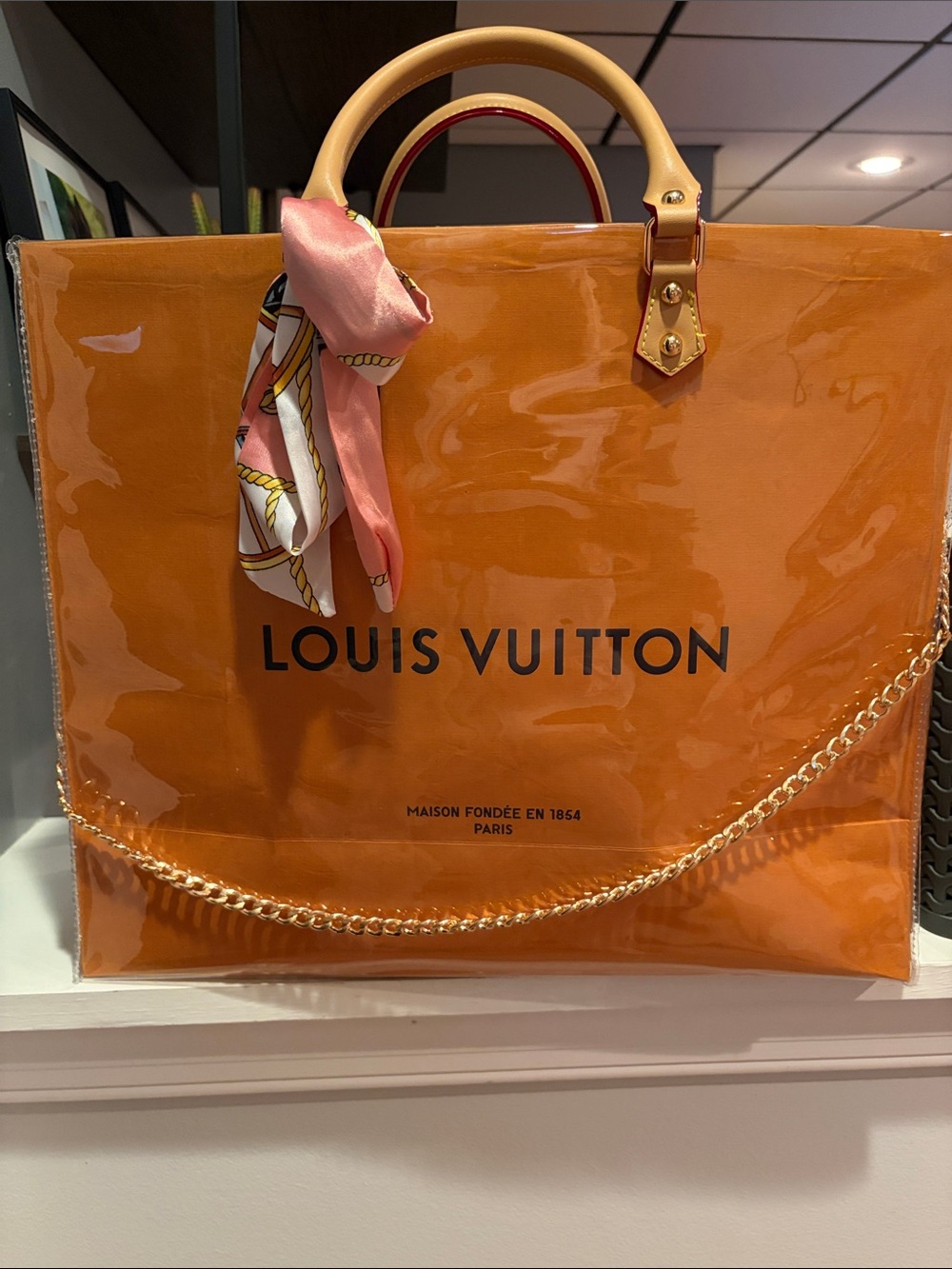 Louis Vuitton Orange Clear Tote with Gold Chain and Pink Scarf Accent